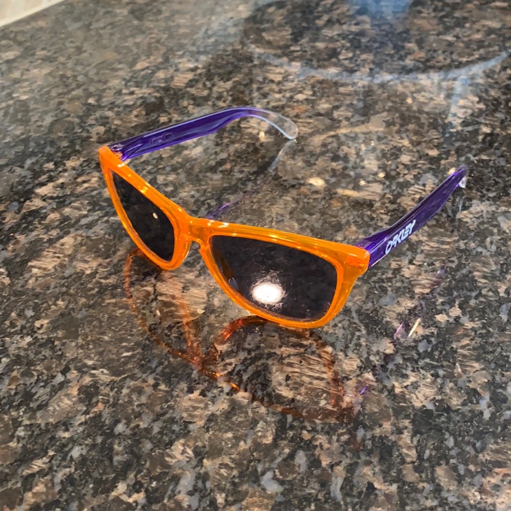 Unique Oakley FrogSkin sunglasses with orange front and purple sides
